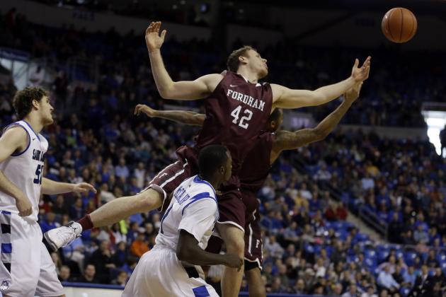 Fordham's Ryan Canty (42) reaches for a rebound during the first half of an NCAA college basketball game against Saint Louis Saturday, Jan. 18, 2014, in St. Louis. (AP Photo/Jeff Roberson)