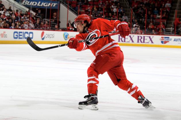 RALEIGH, NC - DECEMBER 23:Justin Faulk #27 of the Carolina Hurricanes fires a slap shot against the Columbus Blue Jackets during their NHL game at PNC Arena on December 23, 2013 in Raleigh, North Carolina. (Photo by Gregg Forwerck/NHLI via Getty Images)