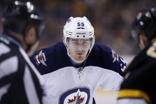 Winnipeg Jets' Mark Scheifele (55) waits for a face off in the third period of an NHL hockey game against the Boston Bruins in Boston, Saturday, Jan. 4, 2014. The Bruins won 4-1. (AP Photo/Michael Dwyer)