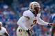 Nov 30, 2013; Gainesville, FL, USA; Florida State Seminoles linebacker Christian Jones (7) rushes against the Florida Gators during the second half at Ben Hill Griffin Stadium. Florida State Seminoles defeated the Florida Gators 37-7. Mandatory Credit: Kim Klement-USA TODAY Sports