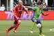 Seattle Sounders' Clint Dempsey, right, tries to hold off Toronto FC's Michael Bradley, left, in the second half of an MLS soccer match on Saturday, March 15, 2014, in Seattle. Toronto won 2-1. (AP Photo/Ted S. Warren)