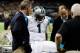 Carolina Panthers' Cam Newton is attended to after injuring his leg during the second half of an NFL football game against the New Orleans Saints Sunday, Dec. 30, 2012, in New Orleans. (AP Photo/Bill Haber)