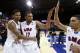 SMU guards Keith Frazier (4), Nick Russell (12) and guard Nic Moore (11) celebrate after winning an NCAA college basketball game against LSU in the second round of the NIT Monday, March 24, 2014, in Dallas, Texas. (AP Photo/Sharon Ellman)