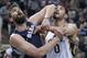 Memphis Grizzlies' Marc Gasol, left, of Spain, and Utah Jazz's Enes Kanter (0), of Turkey, wait for a rebound in the first quarter of an NBA basketball game Wednesday, March 26, 2014, in Salt Lake City. (AP Photo/Rick Bowmer)