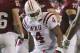 Western Kentucky linebacker Andrew Jackson (4) reacts after Troy quarterback Corey Robinson (6) was sacked in the first half of an NCAA college football game in Troy, Ala., Thursday, Oct. 11, 2012. Robinson was injured on the play. (AP Photo/Dave Martin)