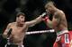Vitor Belfort, from Brazil, right, fights Michael Bisping, from Britain during their middleweight mixed martial arts bout at the Ultimate Fighting Championship (UFC) in Sao Paulo, Brazil, Sunday, Jan. 20, 2013. (AP Photo/Andre Penner)