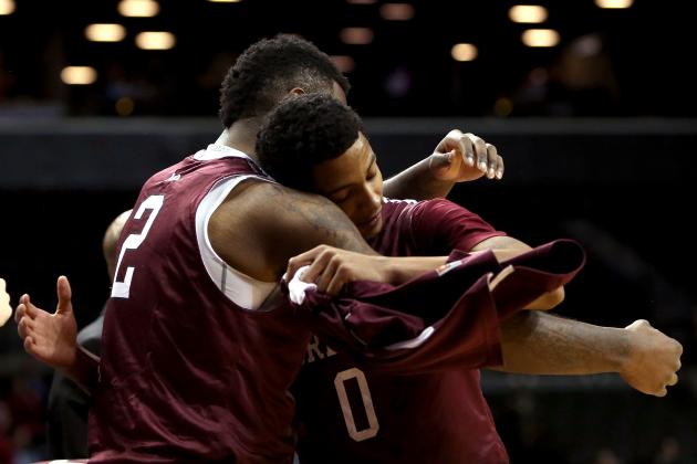 NEW YORK, NY - MARCH 13: Travion Leonard #2 hugs Branden Frazier #0 of the Fordham Rams as Frazier exits the game late in the second half against the Dayton Flyers in the Second Round of the 2014 Atlantic 10 Men's Basketball Tournament at Barclays Center on March 13, 2014 in the Brooklyn Borough of New York City. (Photo by Mike Lawrie/Getty Images)