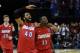 Mar 27, 2014; Memphis, TN, USA; Dayton Flyers forward/center Devon Scott (40) and Scoochie Smith (11) celebrate after defeating the Stanford Cardinal 82-72 in the semifinals of the south regional of the 2014 NCAA Mens Basketball Championship tournament at FedExForum. Mandatory Credit: Nelson Chenault-USA TODAY Sports