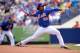 Jenrry Mejia winding up for a pitch.
