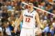 GREENSBORO, NC - MARCH 15: Joe Harris #12 of the Virginia Cavaliers yells to teammates against the Pittsburgh Panthers during the semifinals of the 2014 Men's ACC Basketball Tournament at Greensboro Coliseum on March 15, 2014 in Greensboro, North Carolina. (Photo by Streeter Lecka/Getty Images)