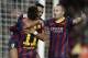 FC Barcelona's Alexis Sanchez, from Chile, second right, reacts after scoring against Espanyol, with his teammate Neymar, from Brazil, left, and Andres Iniesta during a Spanish La Liga soccer match at the Camp Nou stadium in Barcelona, Spain, Friday, Nov. 1, 2013. (AP Photo/Manu Fernandez)