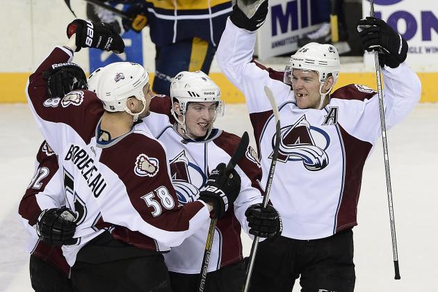 Colorado Avalanche left wing Gabriel Landeskog, left, of Sweden, celebrates with Patrick Bordeleau (58), Matt Duchene (9), and Paul Stastny (26) after Landeskog scored the winning goal against the Nashville Predators during a shootout at an NHL hockey game on Tuesday, March 25, 2014, in Nashville, Tenn. The Avalanche won the shootout to win the game 5-4. (AP Photo/Mark Zaleski)
