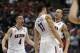 Arizona guard Gabe York, right, celebrates with T.J. McConnell (4) and Aaron Gordon (11) during the second half against San Diego State in a regional semifinal of the NCAA men's college basketball tournament, Thursday, March 27, 2014, in Anaheim, Calif. (AP Photo/Jae C. Hong)