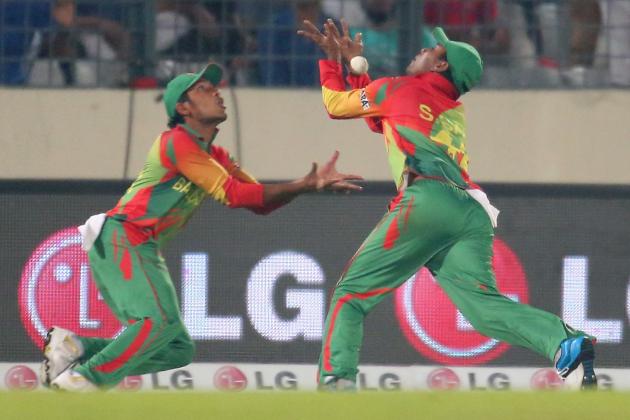 DHAKA, BANGLADESH - MARCH 28:  Anamul Haque and Sohag Gazi of Bangladesh drop a catch in the outfield during the ICC World Twenty20 Bangladesh 2014 match between Bangladesh and India at Sher-e-Bangla Mirpur Stadium on March 28, 2014 in Dhaka, Bangladesh.  (Photo by Scott Barbour/Getty Images)