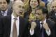 Adam Silver, the new NBA Commissioner, talks with Sacramento Kings majority owner Vivek Ranadive as the Kings play the Toronto Raptors during the first quarter of an NBA basketball game in Sacramento, Calif., Wednesday, Feb. 5, 2014. Silver replaced David Stern Feb. 1, who retired after 30 years as the head of the NBA. (AP Photo/Rich Pedroncelli)