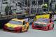 Driver Joey Logano (22) leads Tony Stewart (14) during the NASCAR Sprint Cup series auto race at Bristol Motor Speedway on Sunday, March 16, 2014, in Bristol, Tenn. (AP Photo/Wade Payne)