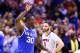 INDIANAPOLIS, IN - MARCH 28: Julius Randle #30 of the Kentucky Wildcats celebrates defeating the Louisville Cardinals 74 to 69 during the regional semifinal of the 2014 NCAA Men's Basketball Tournament at Lucas Oil Stadium on March 28, 2014 in Indianapolis, Indiana. (Photo by Andy Lyons/Getty Images)