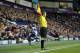 WEST BROMWICH, ENGLAND - FEBRUARY 22: Assistant referee Derek Eaton signals a throw in during the Barclays Premier League match between West Bromwich Albion and Fulham at the Hawthorns on February 22, 2014 in West Bromwich, England. (Photo by Clint Hughes/Getty Images)