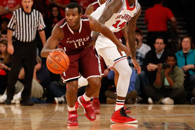 Dec 7, 2013; New York, NY, USA; Fordham Rams guard Jon Severe (10) advances the ball as St. John's Red Storm forward Jakarr Sampson (14) follows during the first half at Madison Square Garden. Mandatory Credit: Anthony Gruppuso-USA TODAY Sports