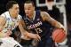 Connecticut's Shabazz Napier, right, moves the ball around Michigan State's Travis Trice in the first half of a regional final at the NCAA college basketball tournament on Sunday, March 30, 2014, in New York. (AP Photo/Seth Wenig)