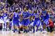 Mar 30, 2014; Indianapolis, IN, USA; Kentucky Wildcats players including Aaron Harrison (2) , James Young (1) and Dakari Johnson (44) celebrate after defeating the Michigan Wolverines in the finals of the midwest regional of the 2014 NCAA Mens Basketball Championship tournament at Lucas Oil Stadium. Mandatory Credit: Bob Donnan-USA TODAY Sports