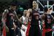 Toronto Raptors guard DeMar DeRozan (10) and forward Amir Johnson (15) congratulate each other as they walk off the court after defeating the Boston Celtics 99-90 in an NBA basketball game in Boston, Wednesday, March 26, 2014. (AP Photo/Elise Amendola)