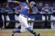 New York Mets' Curtis Granderson plays in an exhibition spring training baseball game against the Washington Nationals, Thursday, March 27, 2014, in Port St. Lucie, Fla. (AP Photo/David Goldman)