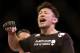 Takanori Gomi reacts after his loss to Clay Guida shortley after their UFC lightweight mixed martial arts match Saturday, Jan. 1, 2011 at The MGM Grand Garden Arena in Las Vegas. Guida won by submission. (AP Photo/Eric Jamison)