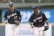 MILWAUKEE, WI - AUGUST 3: Khris Davis #18 of the Milwaukee Brewers and teammate Carlos Gomez #27 run off the field against the Washington Nationals at Miller Park on August 3, 2013 in Milwaukee, Wisconsin. (Photo by Tom Lynn/Getty Images)