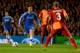 LONDON, ENGLAND - MARCH 18: Eden Hazard of Chelsea takes on Emmanuel Eboue (27) and Felipe Melo of Galatasaray (3) during the UEFA Champions League Round of 16 second leg match between Chelsea and Galatasaray AS at Stamford Bridge on March 18, 2014 in London, England. (Photo by Mike Hewitt/Getty Images)