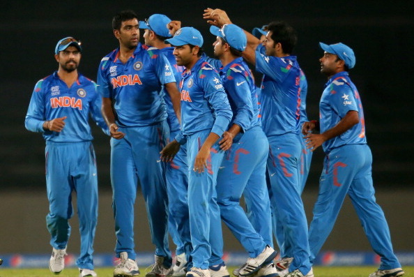 DHAKA, BANGLADESH - MARCH 30:  Ravichandran Ashwin is congratulated by his teammates after dismissing David Warner of Australia during the ICC World Twenty20 Bangladesh 2014 match between India v Australia at Sher-e-Bangla Mirpur Stadium on March 30, 2014 in Dhaka, Bangladesh.  (Photo by Scott Barbour/Getty Images)