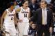 Connecticut head coach Geno Auriemma, right, speaks with Moriah Jefferson, left, and Bria Hartley, center, during the first half of an NCAA college basketball game against Rutgers in the semifinals of the American Athletic Conference women's tournament, Sunday, March 9, 2014, in Uncasville, Conn. (AP Photo/Jessica Hill)