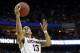 Connecticut's Shabazz Napier drives to the basket during the second half of a second-round game against Saint Joseph's in the NCAA college basketball tournament in Buffalo, N.Y., Thursday, March 20, 2014. (AP Photo/Nick LoVerde)