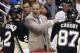 Pittsburgh Penguins' Dan Bylsma, center, gives instructions to Matt Niskanen (2), and Sidney Crosby (87) during a time out in the third period of an NHL hockey game against the Chicago Blackhawks in Pittsburgh, Sunday, March 30, 2014. The Penguins won 4-1. (AP Photo/Gene J. Puskar)