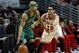 Boston Celtics guard Jerryd Bayless, left, tries to go around Chicago Bulls guard Kirk Hinrich, right, during an NBA basketball game in Chicago, Monday, March 31, 2014. The Bulls won 94-80. (AP Photo/Kamil Krzaczynski)