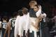 Michigan State's Russell Byrd, second from right, and Travis Trice embrace after their team defeated Virginia 61-59 in a regional semifinal of the NCAA men's college basketball tournament, Saturday, March 29, 2014, in New York. (AP Photo/Frank Franklin II)