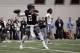 Texas A&M quarterback Johnny Manziel passes the ball during a drill at pro day for NFL football representatives in College Station, Texas, Thursday, March 27, 2014. (AP Photo/Patric Schneider)