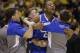 Kentucky's Aaron Harrison celebrates with his teammates after an NCAA Midwest Regional final college basketball tournament game against Michigan Sunday, March 30, 2014, in Indianapolis. Kentucky won 75-72 to advance to the Final Four. (AP Photo/David J. Phillip)