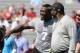 South Carolina defensive end Jadeveon Clowney competes in a drill for NFL representatives at South Carolina football pro day in Columbia, S.C., Wednesday, April 2, 2014. Laughing at far right is Houston Texans coach Bill O'Brien. (AP Photo/Mary Ann Chastain)