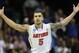 Florida guard Scottie Wilbekin (5) celebrates his basket against Dayton's Vee Sanford during the first half in a regional final game at the NCAA college basketball tournament, Saturday, March 29, 2014, in Memphis, Tenn. (AP Photo/John Bazemore)