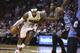 Miami Heat's LeBron James (6) drives around Charlotte Bobcats' Michael Kidd-Gilchrist (14) during the first half of an NBA basketball game in Miami, Monday, March 3, 2014. (AP Photo/J Pat Carter)