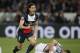 PSG's Edinson Cavani reacts after being penalised for a challenge on Chelsea's Gary Cahill, right, during the Champions League quarterfinal first leg soccer match between PSG and Chelsea, at the Parc des Princes stadium, in Paris, Wednesday, April 2, 2014. (AP Photo/Christophe Ena)