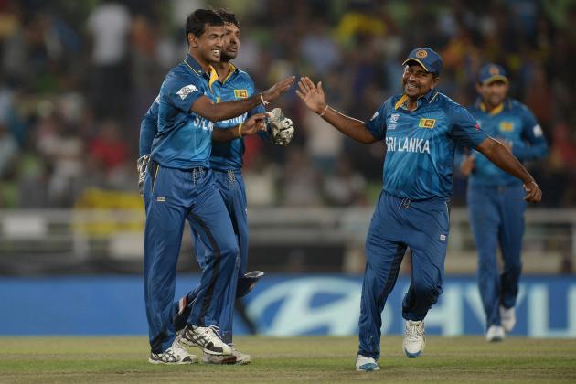 DHAKA, BANGLADESH - APRIL 03:  Nuwan Kulasekara of Sri Lanka celebrates with Rangana Herath of Sri Lanka after dismissing Dwayne Bravo of the West Indies during the ICC World Twenty20 Bangladesh 2014 semi final between Sri Lanka and the West Indies at Sher-e-Bangla Mirpur Stadium on April 3, 2014 in Dhaka, Bangladesh.  (Photo by Gareth Copley/Getty Images)
