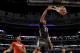 McDonald's West All-American Jahlil Okafor dunks the ball past McDonald's East All-American Karl-Anthony Towns, left, during the second half of the McDonald's All-American boy's basketball game Wednesday, April 2, 2014, in Chicago. The West won 105-102. (AP Photo/Charles Rex Arbogast)