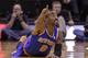 New York Knicks' J.R. Smith (8) points up court after the ball goes out of bounds in the first quarter during an NBA basketball game against the Utah Jazz Monday, March 31, 2014, in Salt Lake City. (AP Photo/Rick Bowmer)