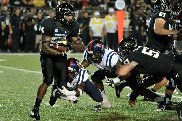 NASHVILLE, TN - AUGUST 29:  Jalen Banks #24 of the Vanderbilt Commodores rushes against the Ole Miss Rebels at Vanderbilt Stadium on August 29, 2013 in Nashville, Tennessee.  (Photo by Frederick Breedon/Getty Images)