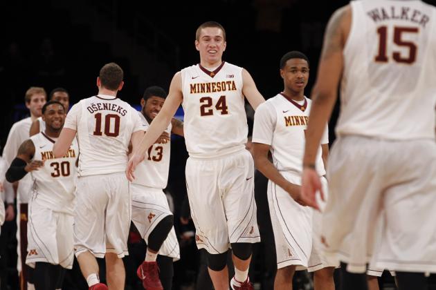 NEW YORK, NY - APRIL 1:   Joey King #24 of the Minnesota Golden Gophers and teammates celebrate a win over Florida State Seminoles during the NIT Championship semifinals at Madison Square Garden on April 1, 2014 in New York City.  (Photo by Jeff Zelevansky/Getty Images)