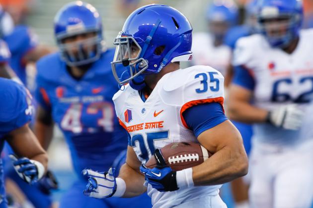 In this Aug. 18, 2013 photo, Boise State running back Charles Bertoli (35) runs the ball during an NCAA college football practice in Boise, Idaho. (AP Photo/Otto Kitsinger)