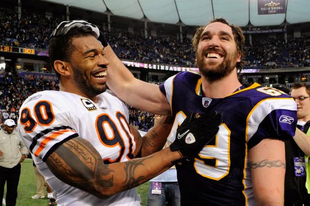 MINNEAPOLIS, MN - JANUARY 1: Julius Peppers #90 of the Chicago Bears and Jared Allen #69 of the Minnesota Vikings speak after their game on January 1, 2012 at Mall of America Field at the Hubert H. Humphrey Metrodome in Minneapolis, Minnesota. The Bears defeated the Vikings 17-13. (Photo by Hannah Foslien/Getty Images)