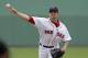 Boston Red Sox starting pitcher Jake Peavy (44) pitches during the first inning of an exhibition baseball game against the Minnesota Twins in Fort Myers, Fla., Saturday, March 29, 2014. (AP Photo/Gerald Herbert)